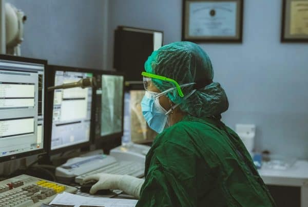 a woman on a computer to represent healthcare cybersecurity
