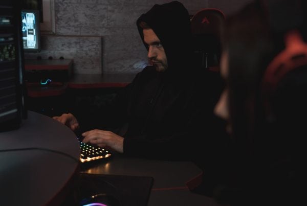a hacker at a computer setting up a remote access trojan